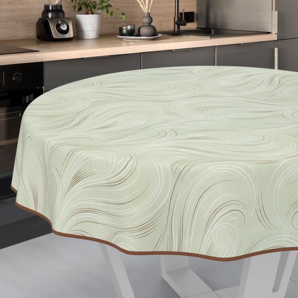Runde Tischdecke mit Wellenmuster auf einem Tisch in einer Küche.