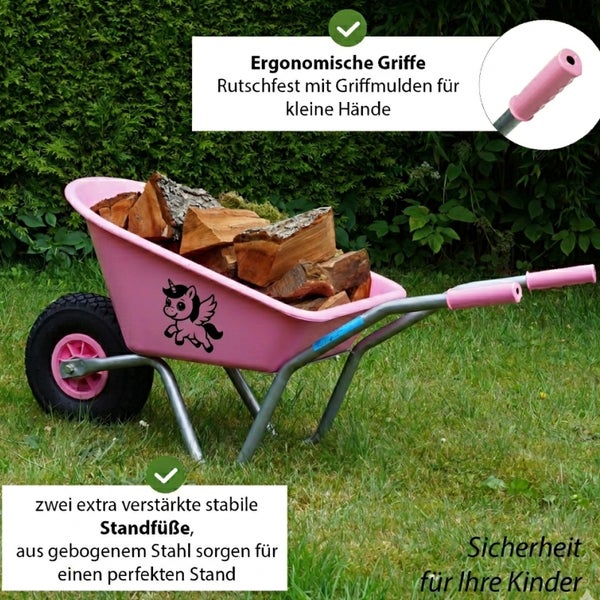 Kinder-Schubkarre mit Einhorn-Motiv, Metallgestell und ergonomischen Griffen, auf einer Rasenfläche mit Holz beladen.
