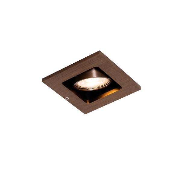 Quadratischer Einbaustrahler in Bronze-Optik, schwenkbar, mit eingeschaltetem Leuchtmittel.
