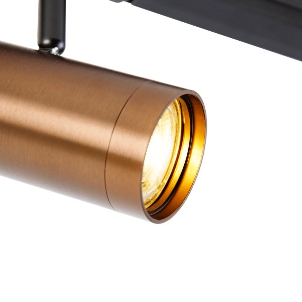 Zylindrischer Strahler aus gebürstetem Metall in Bronzeoptik für Schienensysteme.