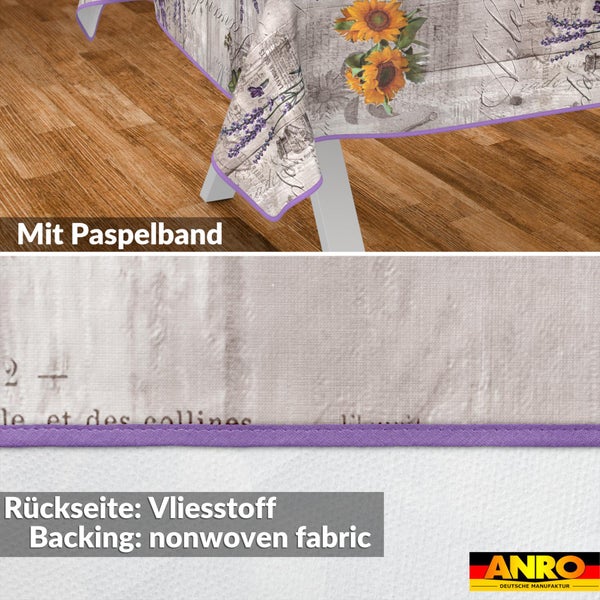 Wachstuch-Tischdecke mit Sonnenblumen- und Lavendel-Motiv, violettem Paspelband und Vlies-Rückseite. ANRO Logo.