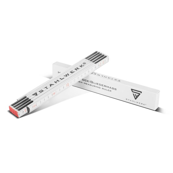 Weißer Gliedermaßstab aus Holz mit metrischer Skala und Stahlwerk Logo neben der Verpackung.