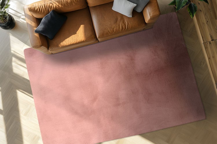 Rechteckiger Teppich in Wohnzimmer mit Leder Sofa und Parkettboden Ansicht von oben