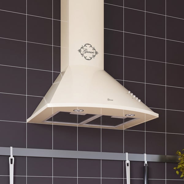 Wandhaube Gurari im Retrodesign mit Fettfiltern und Beleuchtung montiert an einer gefliesten Küchenwand.