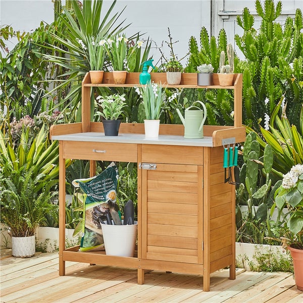 Gartentisch mit Ablage, Schublade und Schrank für Gartenarbeiten im Freien.