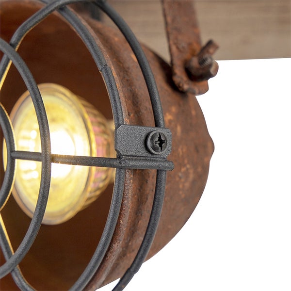 Detailaufnahme einer Wandleuchte im Vintage-Stil mit Käfigschutz und rostfarbenem Finish