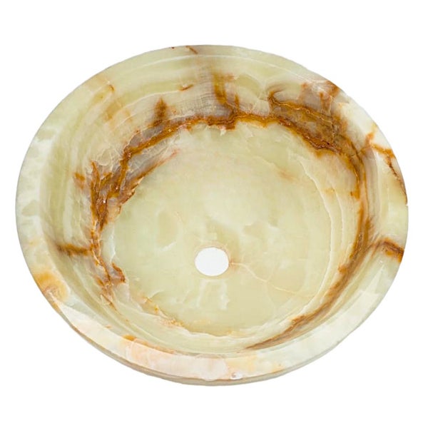 Rundes Waschbecken aus Naturstein in Beige- und Brauntönen mit polierter Oberfläche.