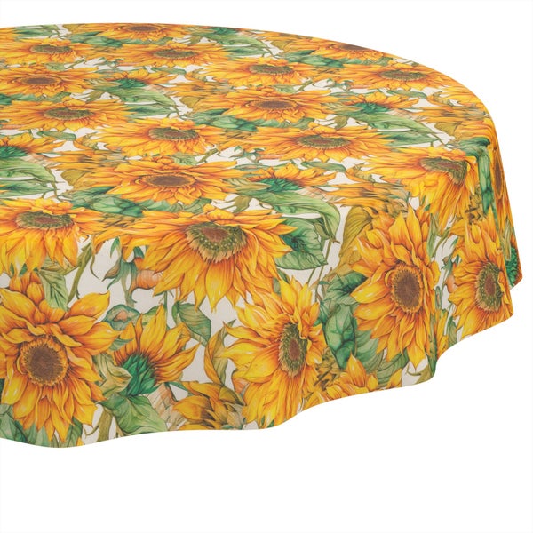 Rundes Tischtuch mit einem vollflächigen Muster aus gelben Sonnenblumen und grünen Blättern.
