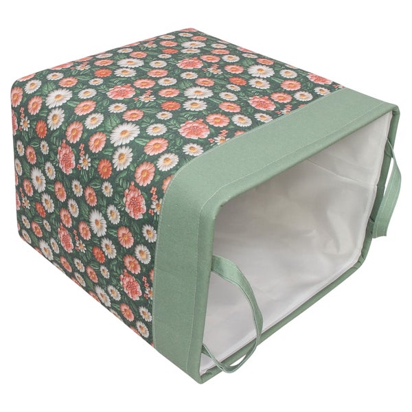 Grüne Aufbewahrungsbox aus Stoff mit floralem Muster und Tragegriffen.