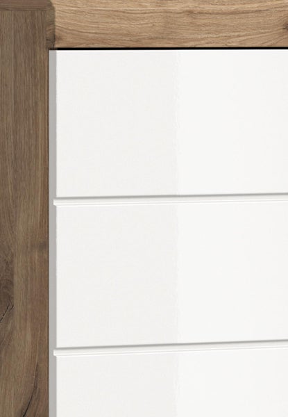 Detailansicht einer Möbelfront mit Holzrahmen und weißen Hochglanz-Paneelen.