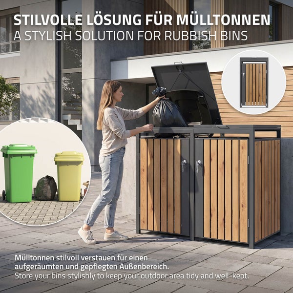 Mülltonnenbox aus Metall und Holzoptik mit zwei Fächern für ein aufgeräumtes Erscheinungsbild im Außenbereich mit einer Person beim Befüllen.