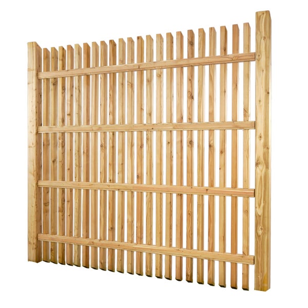 Holzzaun im Garten mit Blumenbeet