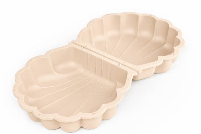 Zweiteilige Sand- und Wassermuschel aus Kunststoff in Beige.