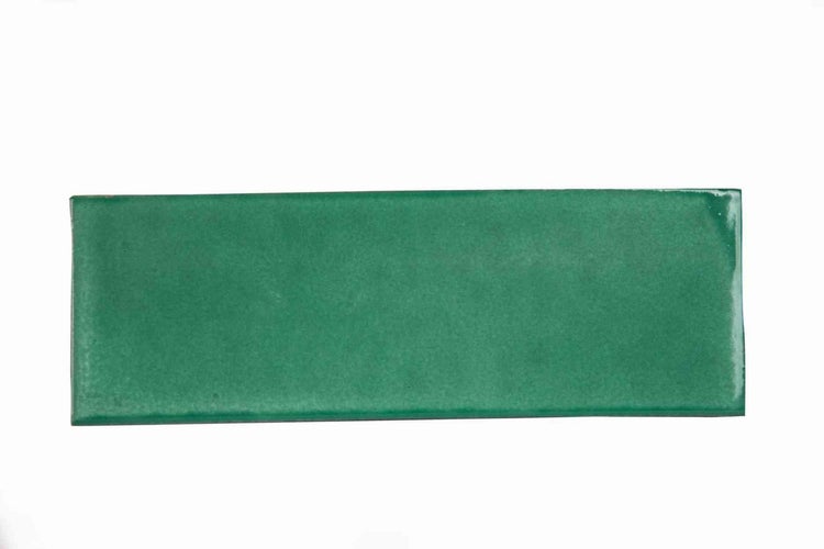 Rechteckige glänzende Wandfliese aus Keramik in Grün.