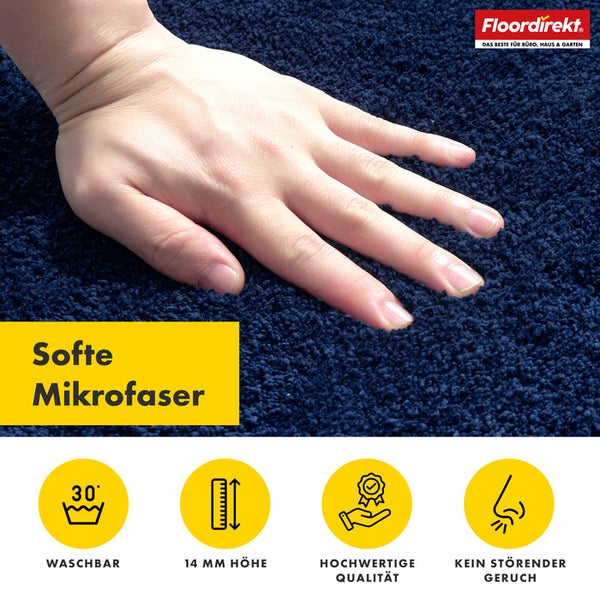 Detailansicht eines dunkelblauen Teppichs mit dem Hinweis auf weiche Mikrofaser, Waschbarkeit bei 30 Grad, 14 Millimeter Höhe, hohe Qualität und geruchsneutral. Floor direkt Logo.