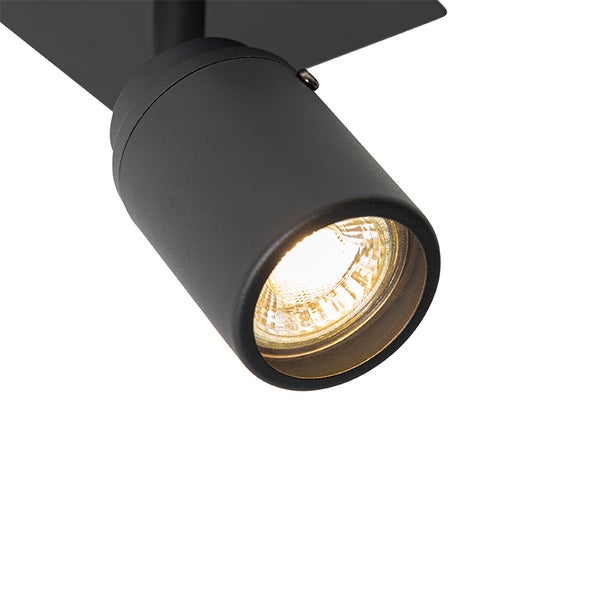 Schwarzer Deckenstrahler mit eingeschalteter Lampe