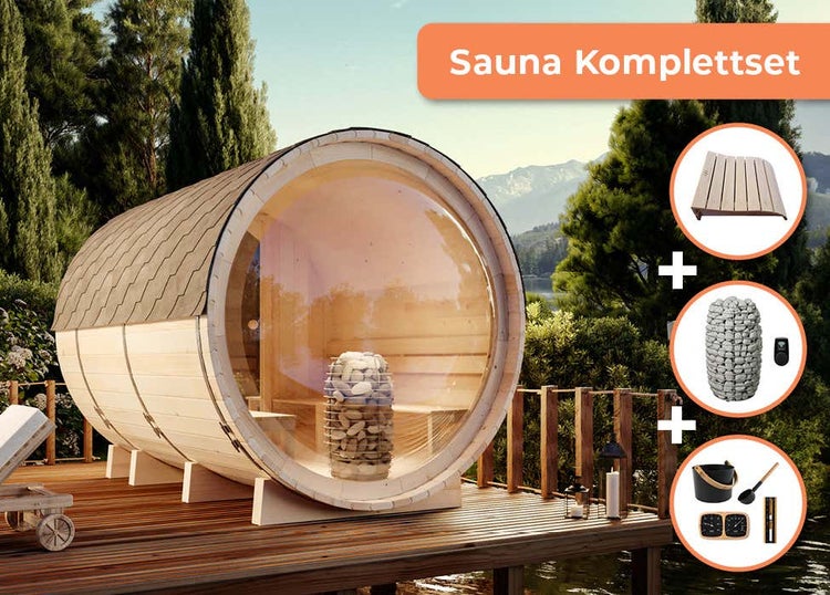 Fasssauna Komplettset aus hellem Holz mit Panorama-Glasfront auf einer Terrasse, inklusive Saunaofen, Steinen, Kopfstütze und Zubehör-Set.