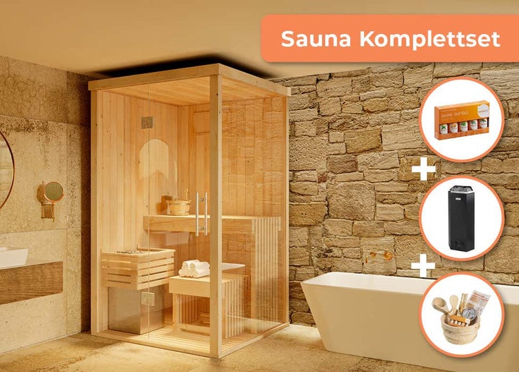 Sauna Komplettset aus Holz mit Glasfront in Badezimmer mit Wanne. Inklusive Saunaofen, Duftset und Zubehör wie Kübel und Kelle.